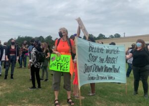 Photo: protestors demonstrating outside Irwin County Detention Center